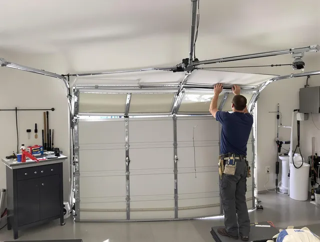 Westchester Garage Door Repair specialist performing precise section replacement on Westchester garage door